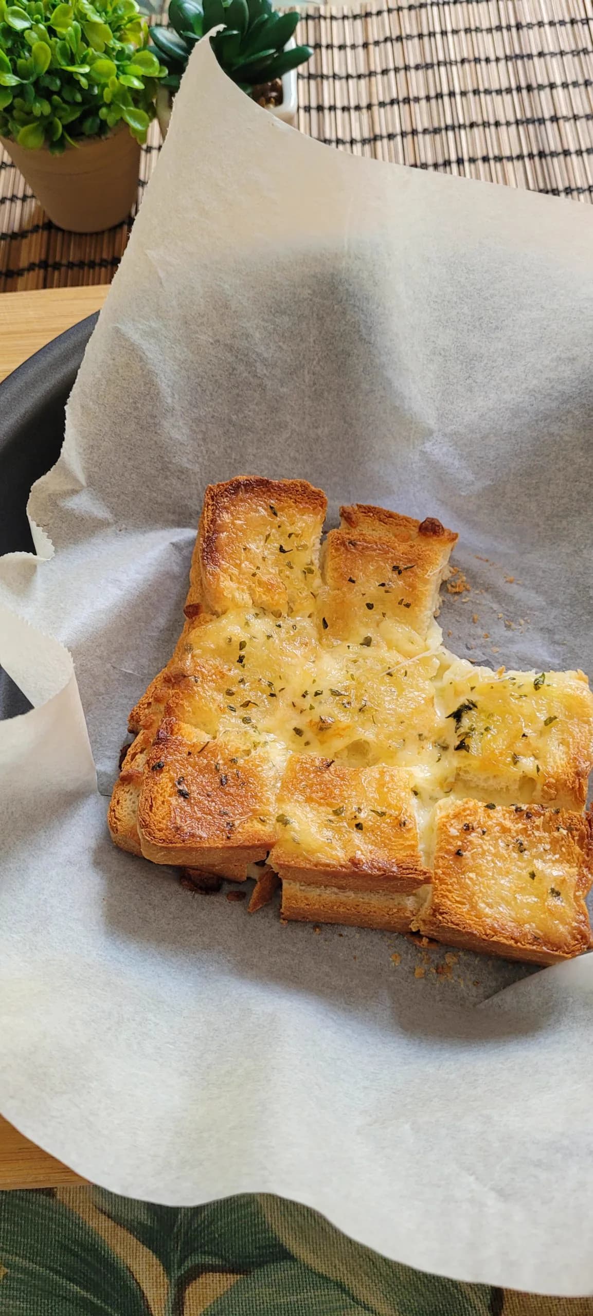 Slices of cheesy garlic toast baked until golden