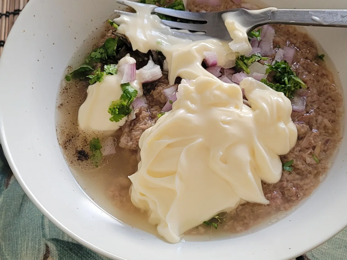 Mayonnaise added to tuna filling with onion and spring onion